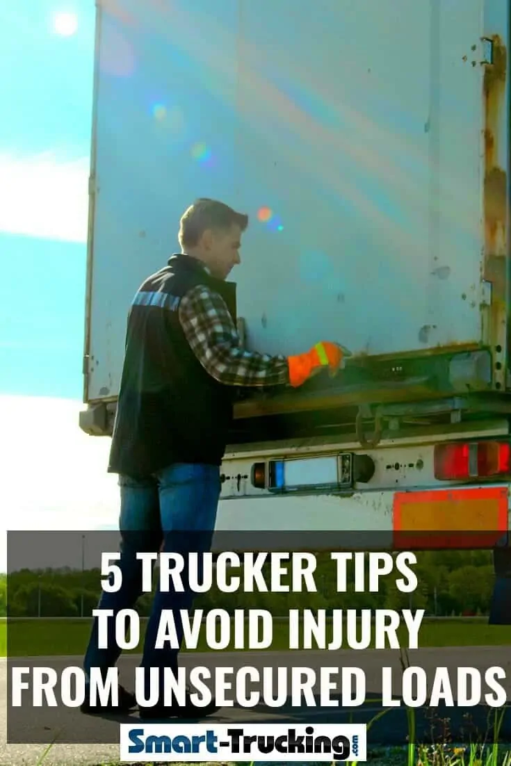 Truck driver opening rear doors of a trailer