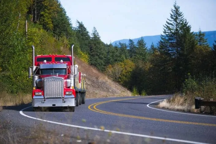 Red Kenworth W900 Driving on Sunny Day