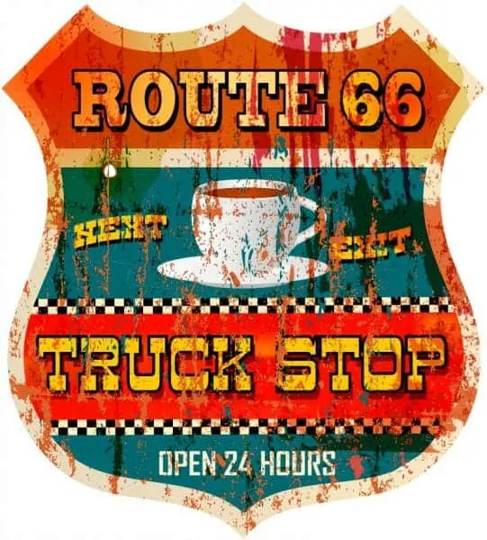 A recreation of an old Route 66 truck stop sign. It has a drawing of a cup of coffee is the center.