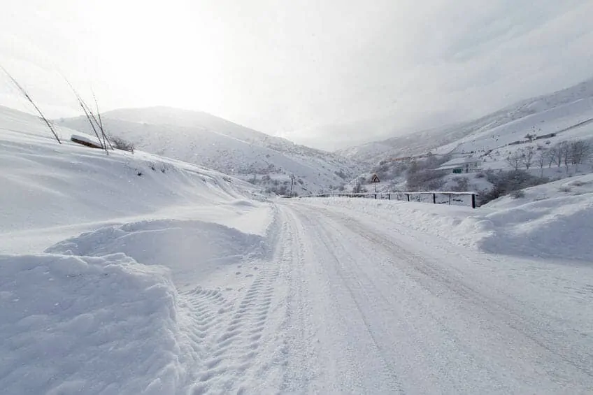 Winter Road Snow Covered in Mountain Area