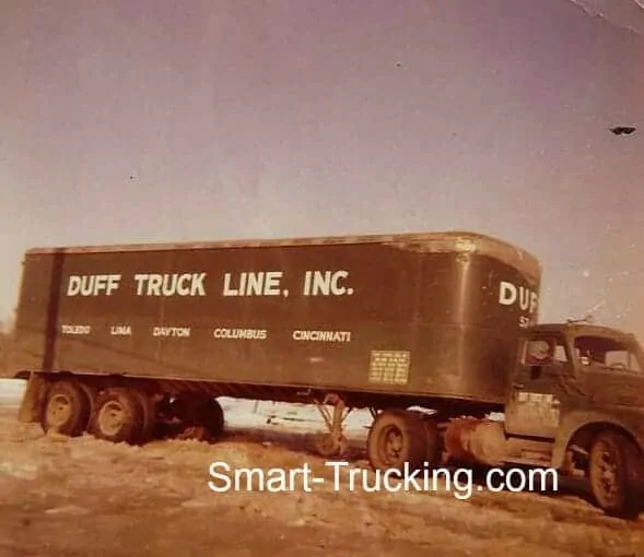 An old photo of an old R-model International Big-rig Duff truck. It is smaller than modern trucks.  