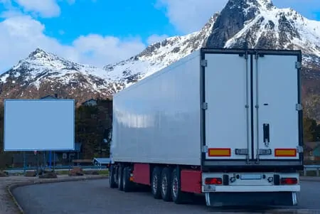 Tractor trailer driving through the mountain roads