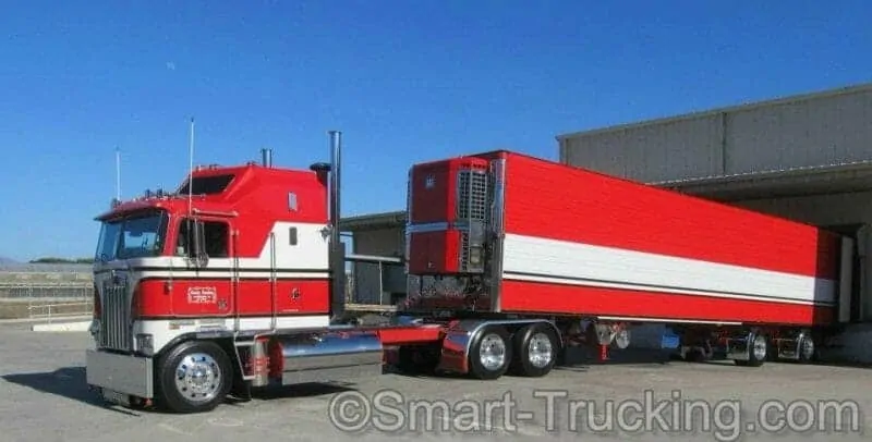 A photo of an old-school Kenworth K100 Cabover Red White Truck.