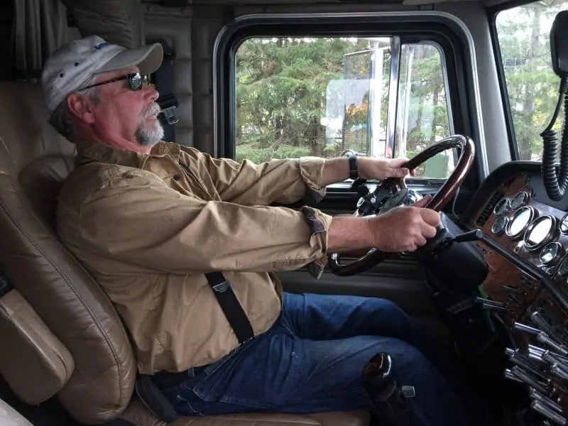 Truck Driver Holding Tight to Steering Wheel
