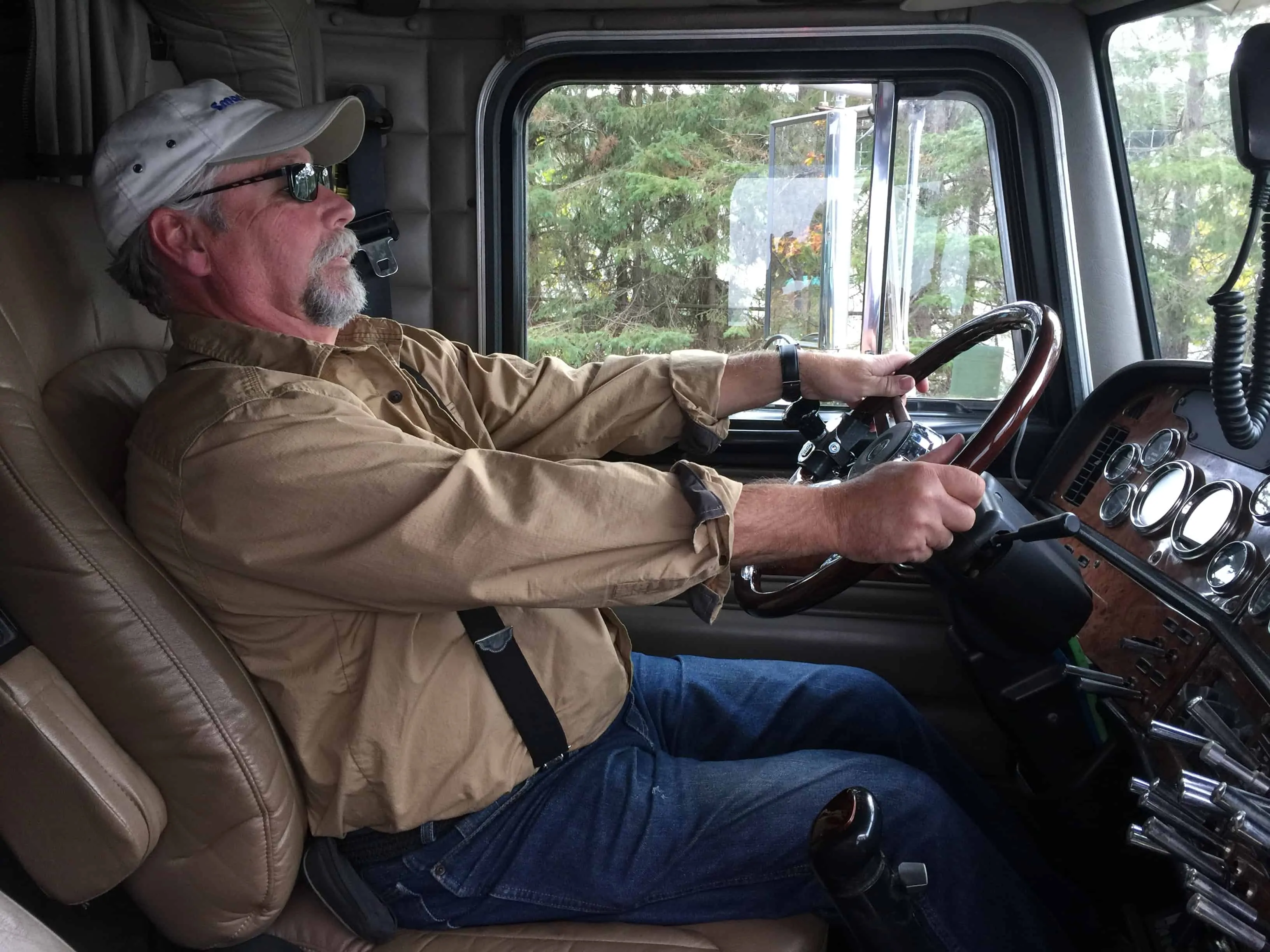 Truck Driver Holding Tight to Steering Wheel