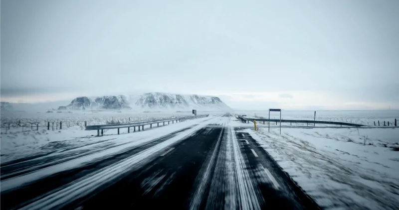 Snowy Highway Near Mountains