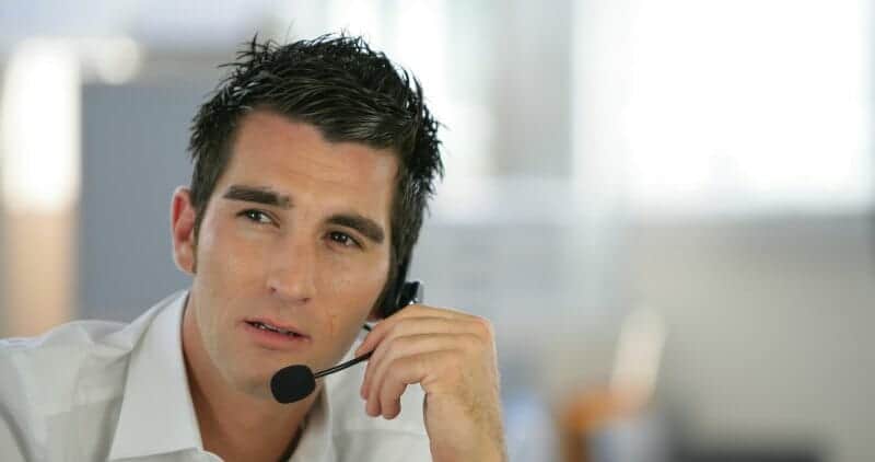 Dispatcher at trucking company on telephone headset 