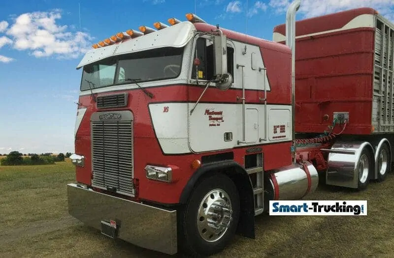 Red and White Freightliner Cabover with Trailer