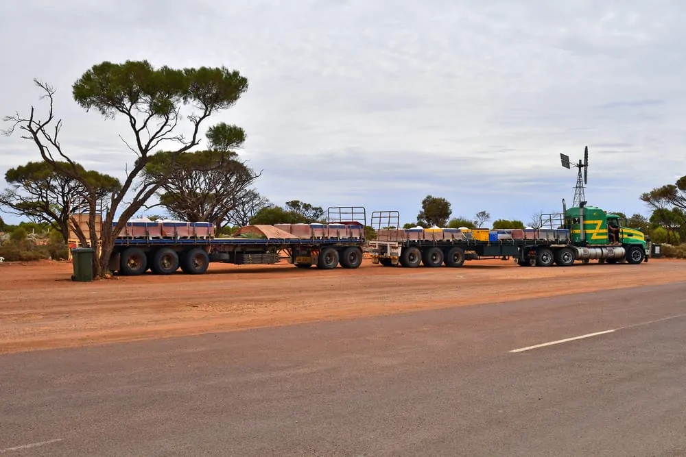 Truck usually called Road Train with trailers at outback roadhouse on Stuart highway in South Australia