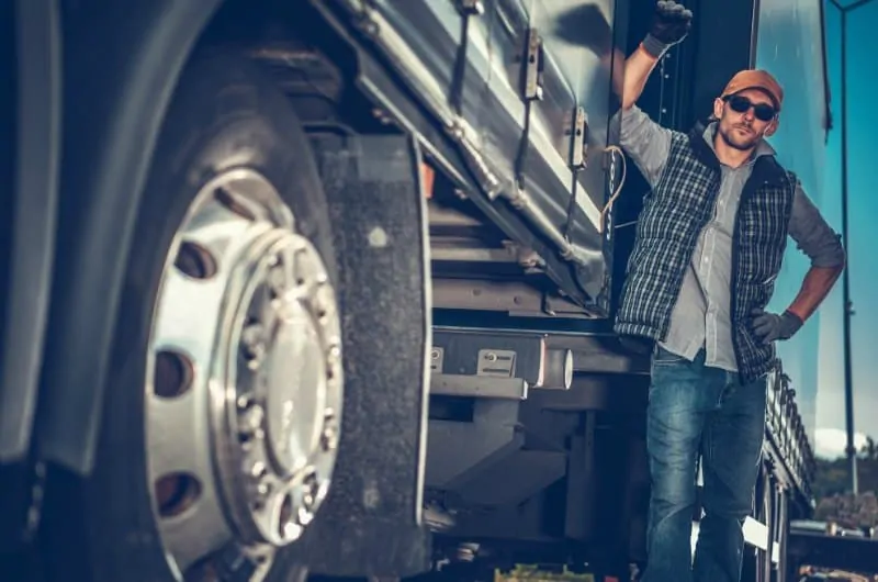 Truck Driver Standing by Truck