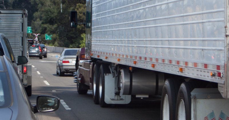 Big rig truck on the highway in traffic