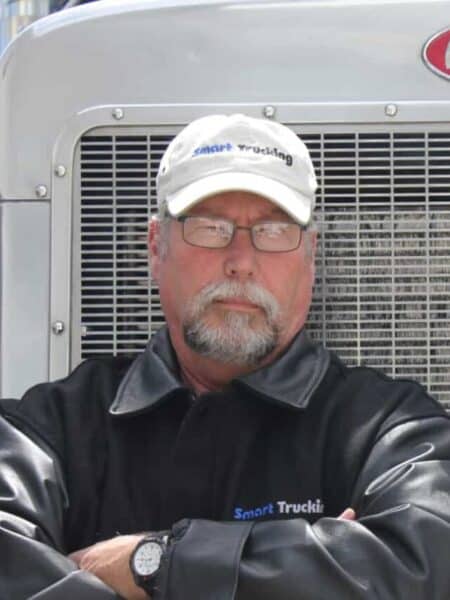 Truck Driver standing next to his truck