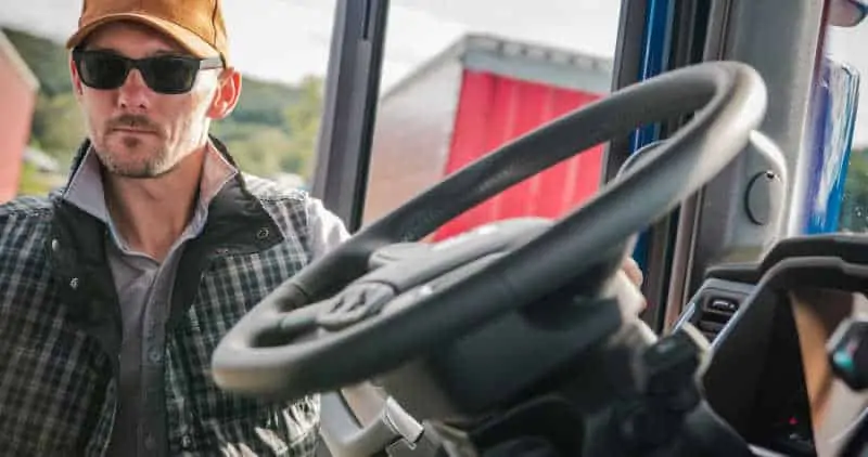 Truck Driver Getting in His Truck