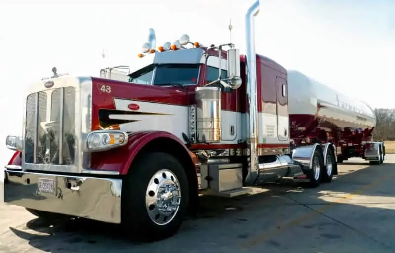 A photo of a large long-nose truck in red.