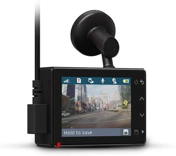 A photo of a dash cam. The screen is showing a preview of what the camera sees. 
