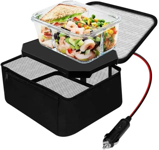 A photo of a portable slow cooker. A container of food is being warmed on top. You can also see the power adapter.