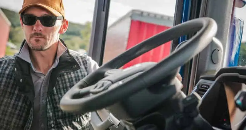 Truck Driver Getting Into His Truck