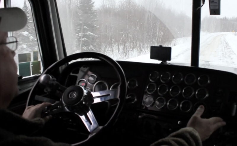 truck driver driving in winter