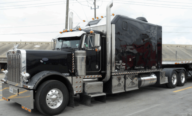 Long Wheelbase Truck in Black, Peterbilt, with a large size sleeper berth.