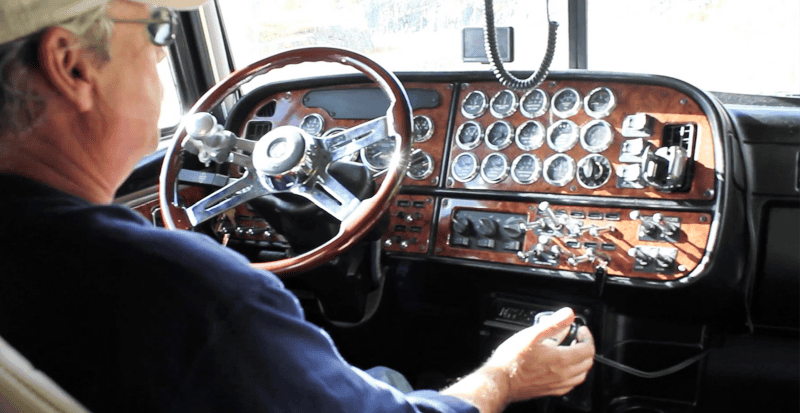 Truck driver shifting his 2004 379 Peterbilt with an 18 speed Eaton Fuller transmission.