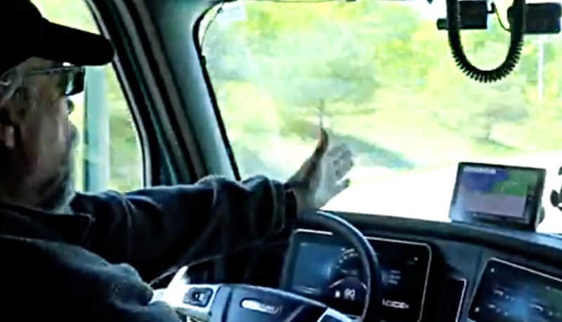 Truck Driver at the wheel of a 2022 Cascadia Freightliner